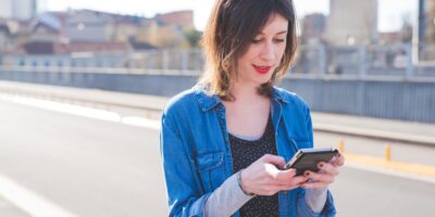 portrait of young woman using smartphone