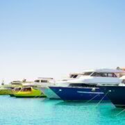 Seascape with parking and anchored boats and ships