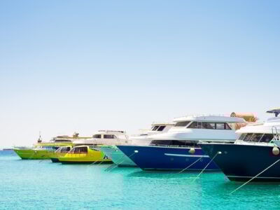 Seascape with parking and anchored boats and ships
