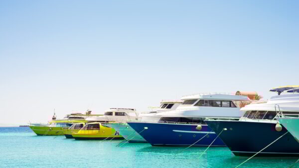 Seascape with parking and anchored boats and ships