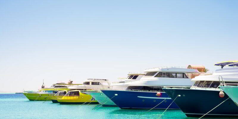 Seascape with parking and anchored boats and ships